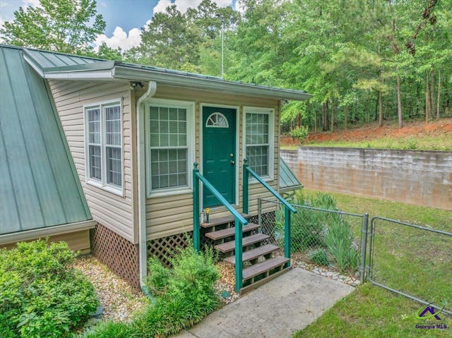 124 Joy Dr, Warner Robins, GA 31088 - view of outbuilding with entry steps, fence, and a gate