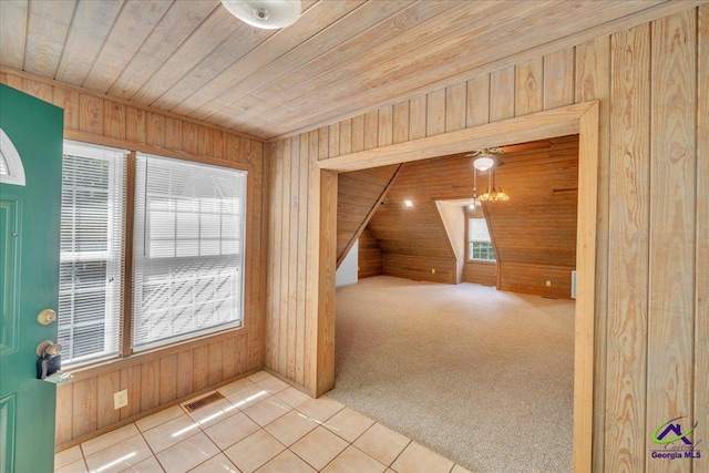 124 Joy Dr, Warner Robins, GA 31088 - additional living space with wooden walls, visible vents, wood ceiling, and tile patterned flooring