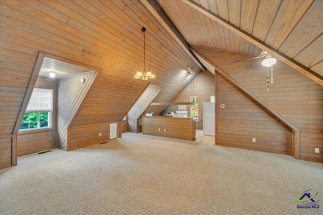 124 Joy Dr, Warner Robins, GA 31088 - additional living space with visible vents, carpet flooring, wood ceiling, and wooden walls