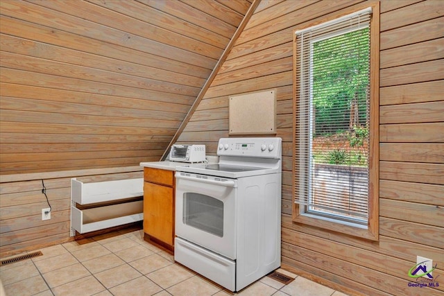 124 Joy Dr, Warner Robins, GA 31088 - washroom featuring visible vents, light tile patterned floors, wooden walls, and a wealth of natural light