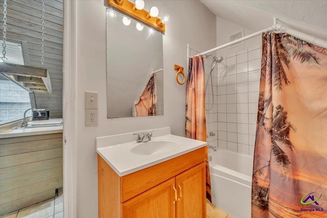 124 Joy Dr, Warner Robins, GA 31088 - full bath featuring vanity, vaulted ceiling, shower / bathtub combination with curtain, and visible vents