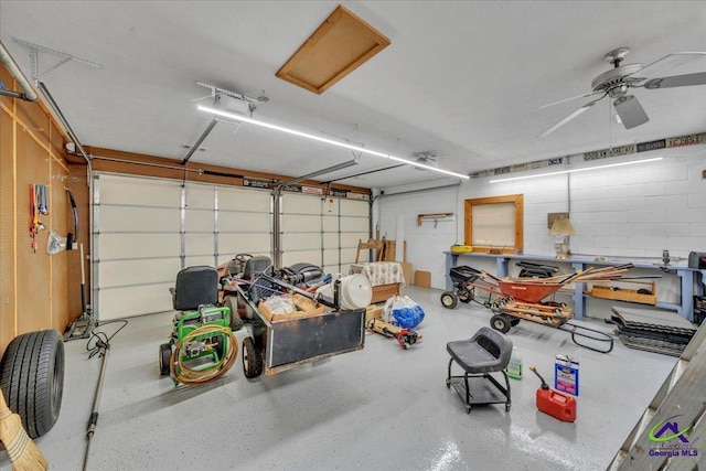 124 Joy Dr, Warner Robins, GA 31088 - garage featuring a ceiling fan