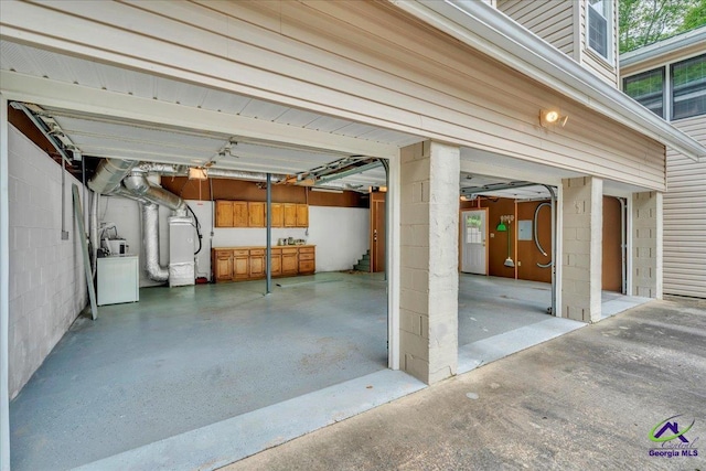 124 Joy Dr, Warner Robins, GA 31088 - garage featuring washer / dryer and fridge