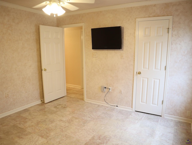 unfurnished bedroom featuring crown molding, baseboards, and ceiling fan