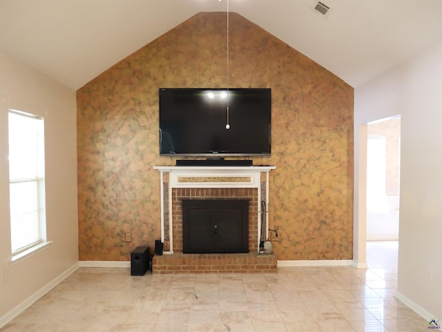 unfurnished living room featuring baseboards, a fireplace, vaulted ceiling, and visible vents
