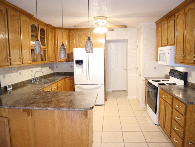 kitchen with brown cabinetry, dark countertops, light tile patterned floors, a peninsula, and white appliances