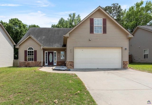 203 York Ln, Macon, GA 31220 - traditional-style house with concrete driveway, a front yard, and stone siding