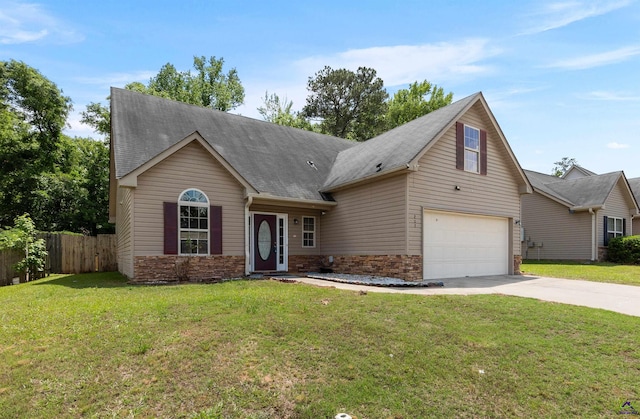203 York Ln, Macon, GA 31220 - view of front facade featuring a front lawn, fence, a shingled roof, concrete driveway, and an attached garage