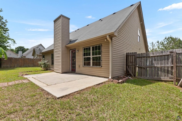 203 York Ln, Macon, GA 31220 - rear view of property featuring a patio area, fence, a yard, and a chimney