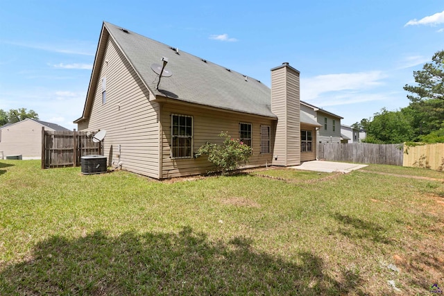 203 York Ln, Macon, GA 31220 - back of house featuring fence, a patio, a chimney, and a lawn