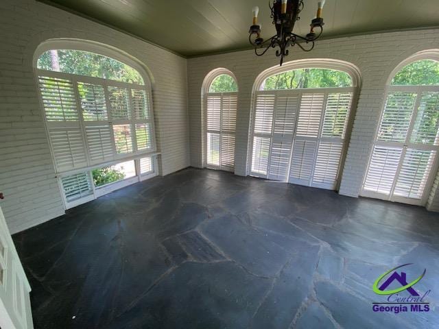 1218 Nottingham Dr, Macon, GA 31210 - unfurnished dining area featuring a notable chandelier