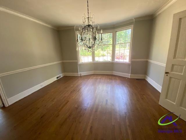 1218 Nottingham Dr, Macon, GA 31210 - unfurnished dining area featuring dark wood-style flooring, baseboards, a chandelier, and ornamental molding