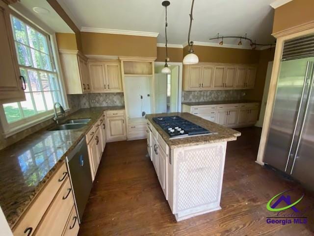 1218 Nottingham Dr, Macon, GA 31210 - kitchen with stone countertops, a center island, a sink, appliances with stainless steel finishes, and backsplash