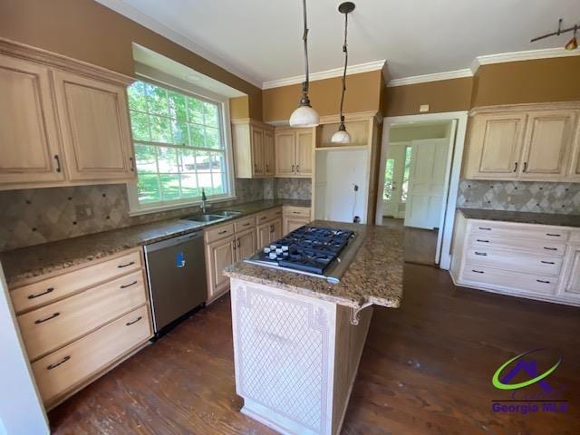 1218 Nottingham Dr, Macon, GA 31210 - kitchen featuring crown molding, appliances with stainless steel finishes, a kitchen island, and tasteful backsplash