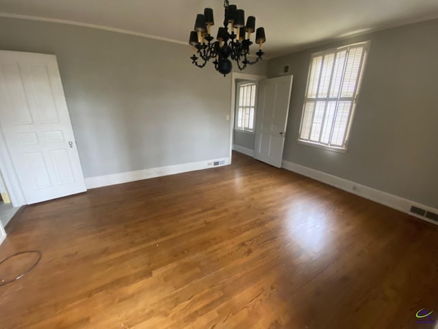 1218 Nottingham Dr, Macon, GA 31210 - unfurnished dining area with visible vents, baseboards, wood finished floors, and a chandelier