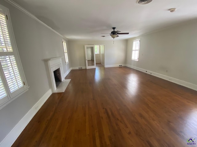 1218 Nottingham Dr, Macon, GA 31210 - unfurnished living room featuring a ceiling fan, dark wood-style flooring, a fireplace with flush hearth, baseboards, and ornamental molding
