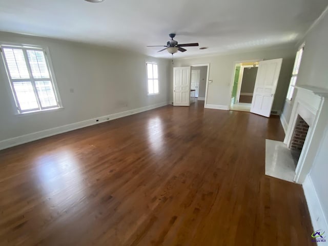 1218 Nottingham Dr, Macon, GA 31210 - unfurnished living room with baseboards, ceiling fan, dark wood-style floors, and a fireplace