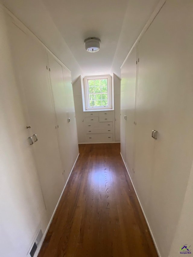1218 Nottingham Dr, Macon, GA 31210 - hall featuring baseboards, lofted ceiling, wood finished floors, and visible vents