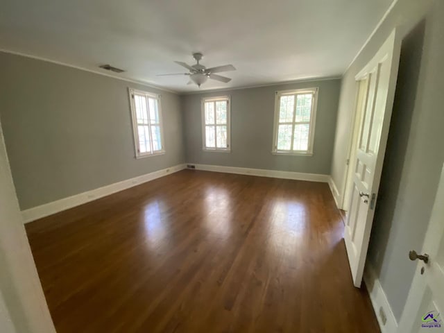 1218 Nottingham Dr, Macon, GA 31210 - empty room with plenty of natural light, ornamental molding, baseboards, and dark wood-type flooring
