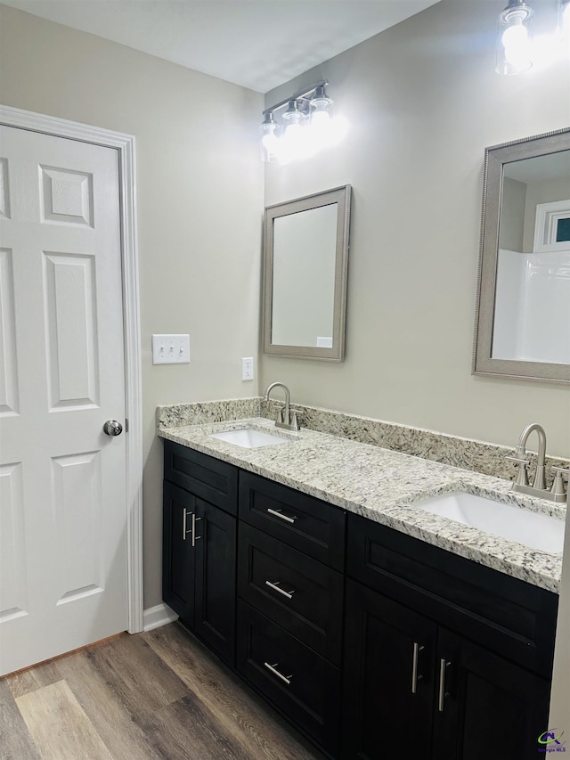325 Peach Cir, Fort Valley, GA 31030 - full bath with double vanity and wood finished floors