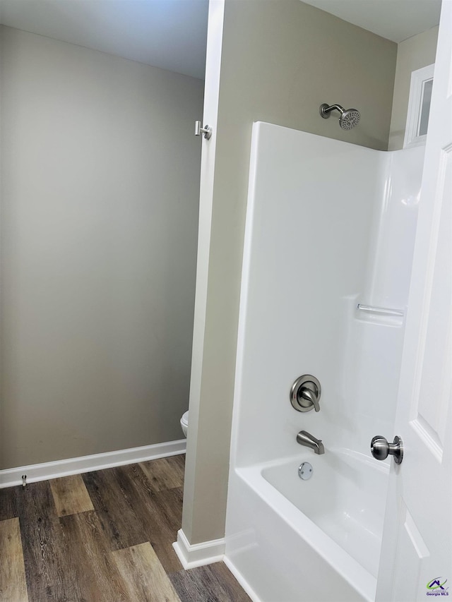 325 Peach Cir, Fort Valley, GA 31030 - bathroom featuring wood finished floors and shower / bath combination