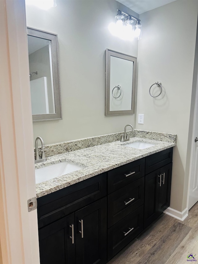 325 Peach Cir, Fort Valley, GA 31030 - bathroom with wood finished floors and double vanity