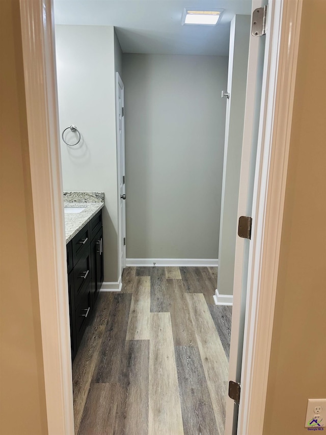 325 Peach Cir, Fort Valley, GA 31030 - bathroom featuring wood finished floors and vanity