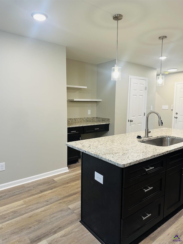 325 Peach Cir, Fort Valley, GA 31030 - kitchen with dark cabinets, open shelves, light wood-style floors, hanging light fixtures, and recessed lighting