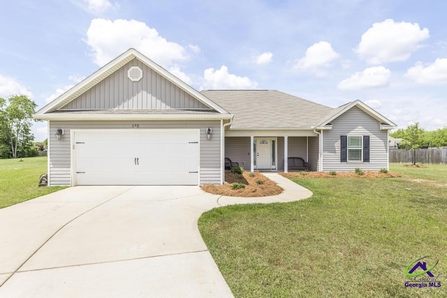 122 Milford Cir, Perry, GA 31069 - ranch-style home featuring a garage, a front lawn, board and batten siding, and concrete driveway