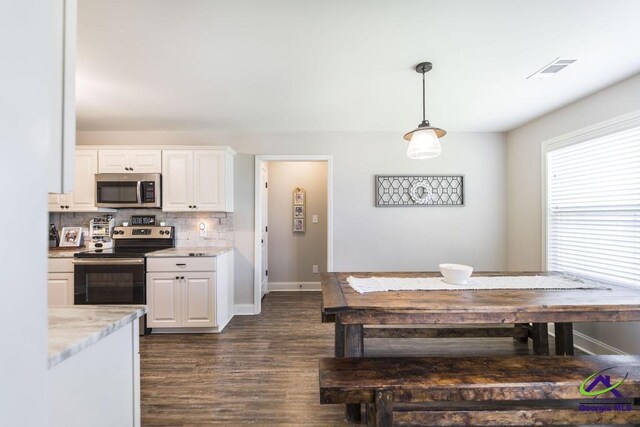 122 Milford Cir, Perry, GA 31069 - kitchen featuring white cabinets, hanging light fixtures, stainless steel appliances, tasteful backsplash, and dark wood-type flooring