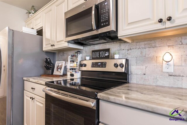 122 Milford Cir, Perry, GA 31069 - kitchen with decorative backsplash and stainless steel appliances