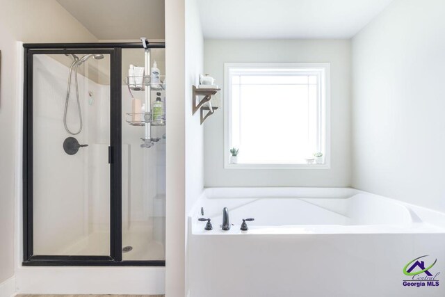 122 Milford Cir, Perry, GA 31069 - full bath with a shower stall and a garden tub
