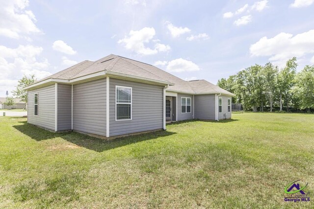 122 Milford Cir, Perry, GA 31069 - back of house with a lawn