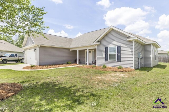 122 Milford Cir, Perry, GA 31069 - ranch-style house with a garage, concrete driveway, and a front yard