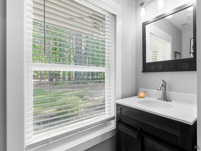 bathroom with visible vents and vanity