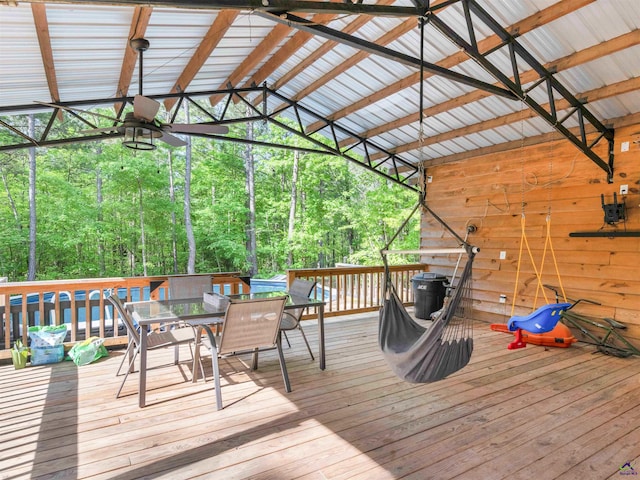 wooden deck featuring outdoor dining area