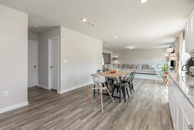 dining area featuring recessed lighting, baseboards, visible vents, and wood finished floors