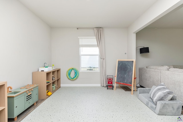 game room with baseboards
