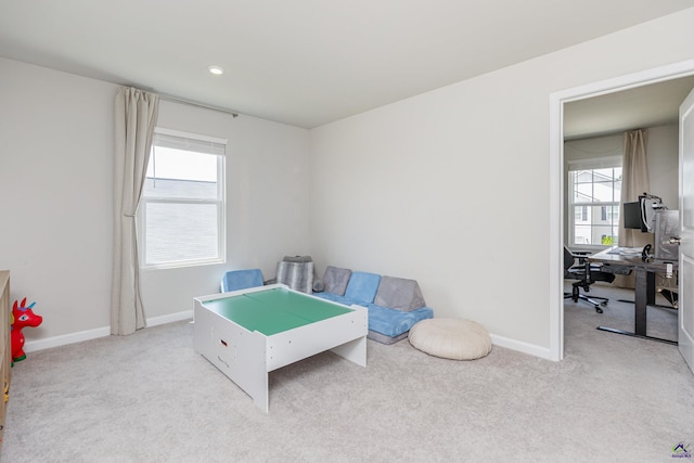 playroom with baseboards and carpet flooring