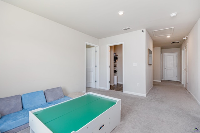unfurnished bedroom featuring visible vents, recessed lighting, baseboards, and light colored carpet