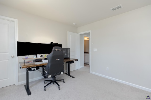 home office with baseboards, visible vents, and carpet