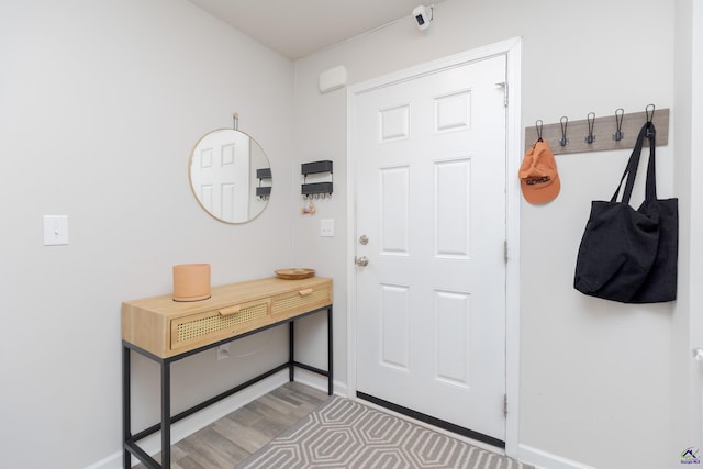 interior space with light wood-style floors and baseboards