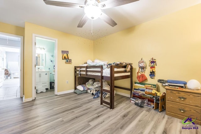 410 Steeplechase Rd, Macon, GA 31216 - bedroom with baseboards, ceiling fan, ensuite bath, and wood finished floors
