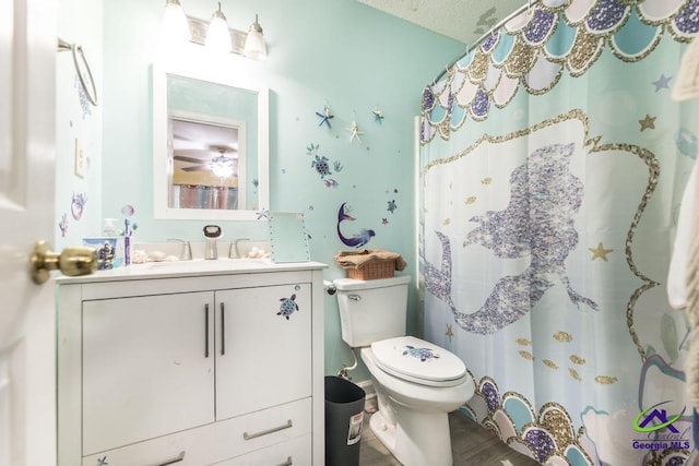 410 Steeplechase Rd, Macon, GA 31216 - full bathroom with vanity, a shower with curtain, toilet, and wood finished floors