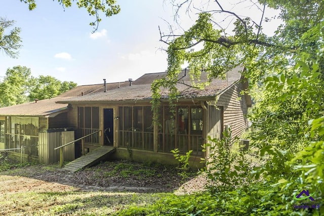 410 Steeplechase Rd, Macon, GA 31216 - back of property with a sunroom and a shingled roof