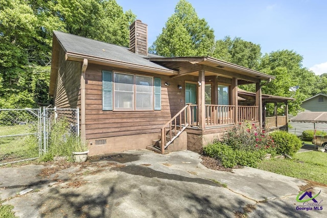 410 Steeplechase Rd, Macon, GA 31216 - view of front of property with fence, a chimney, a gate, crawl space, and a porch