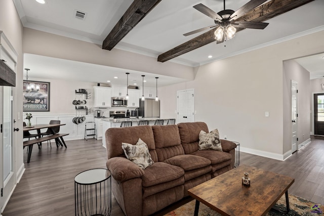 living room with beamed ceiling, visible vents, dark wood-style floors, and ceiling fan with notable chandelier