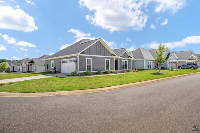 craftsman house with a garage, a residential view, board and batten siding, and a front yard