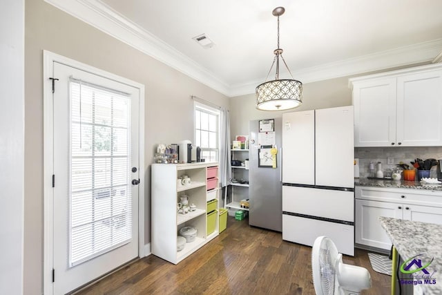 interior space with ornamental molding, dark wood-style floors, and visible vents