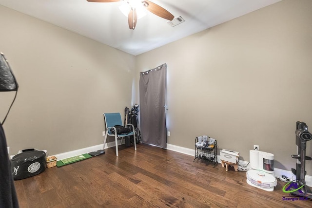 miscellaneous room featuring visible vents, a ceiling fan, baseboards, and wood finished floors